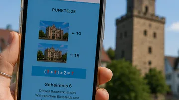 Hand holding smartphone with puzzle app displayed.