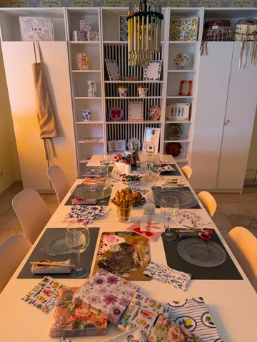 Craft table setup in decorated room.
