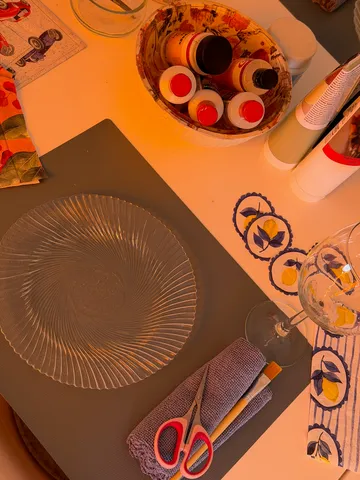 Art supplies scattered on a table.