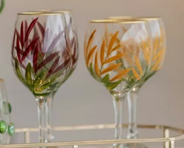 Decorative glasses standing on a tray.