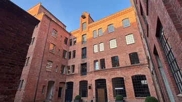 Brick building with large windows, daytime