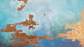 Abstract gold patterns on blue background