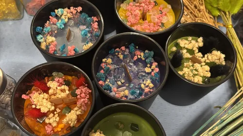 Colorful decorative candles on display table.