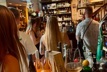 People socializing in a crowded bar.