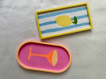 Trays with lemon and cocktail designs.