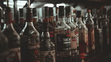 Bottles of liquor on display shelf.