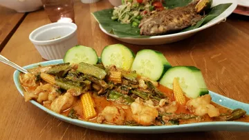 Colorful Thai curry served in a dish.
