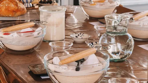 Baking tools and ingredients on a wooden table.