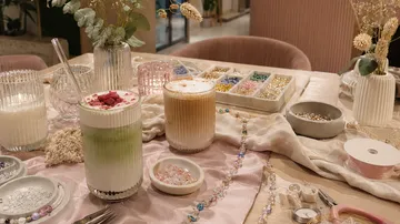 Drinks and crafts on a table.
