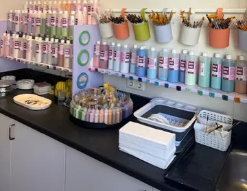 Art supplies displayed on studio countertop.