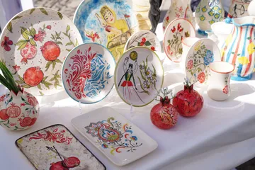 Colorful painted ceramics displayed on a table.
