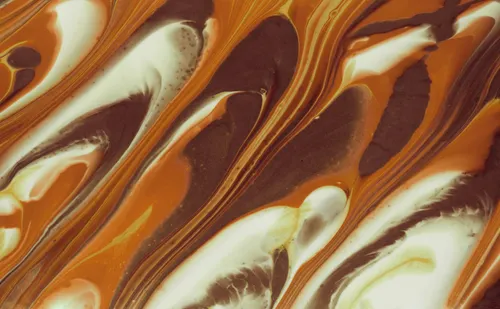 Swirls of white, brown, and orange colors.