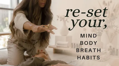 Woman performing reiki therapy, serene room.