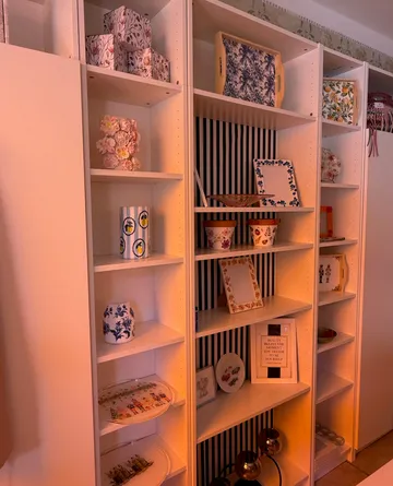 Shelves displaying decorative items in warm lighting.