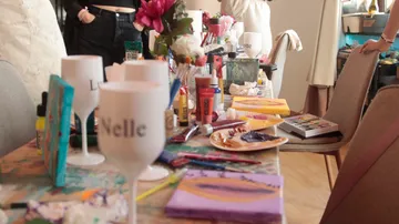 Art supplies on table during painting session.
