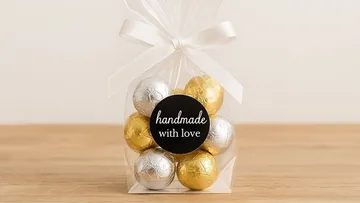 Gift bag with gold and silver chocolates.