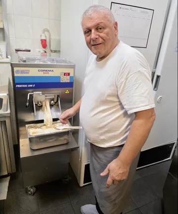 Man making ice cream in kitchen.