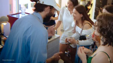 Group of people socializing in a store.