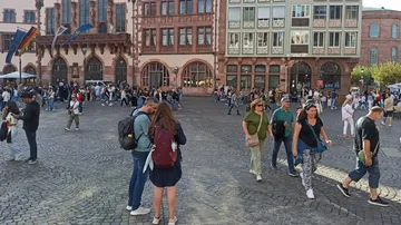 People walking in busy town square