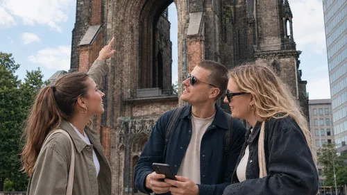 Tourists admire historic church ruins outside.
