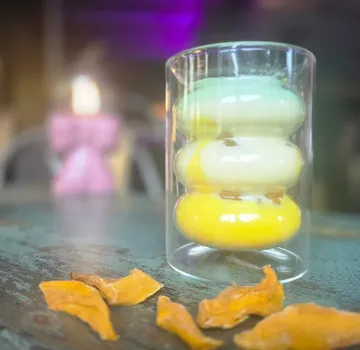 Stacked macarons in glass, table setting