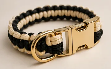 Two-tone paracord bracelet with gold clasp.
