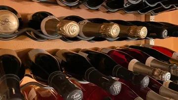Wine bottles displayed in a rack.