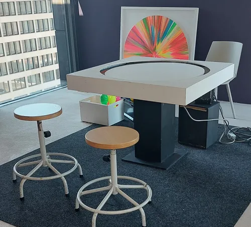 Stools and table in modern office space.