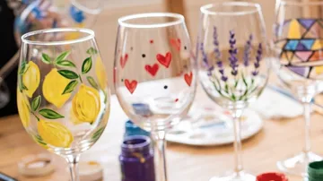 Decorated wine glasses on a table.