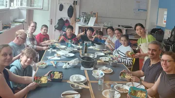 People sharing a meal around a table.