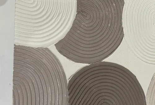 Textured circles pattern, neutral colors.