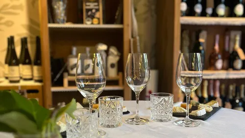 Wine glasses on a table in a wine shop.