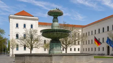 Fountain in front of a historic building.