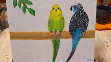Parakeets sitting on a branch, painting.