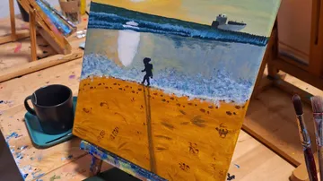 Gemälde eines Kindes am Strand.