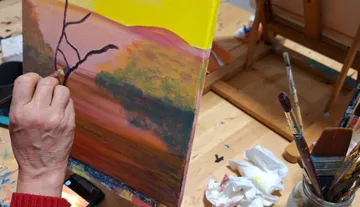 Hand painting tree on colorful landscape canvas.