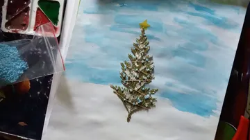 Crafted tree with star on table.