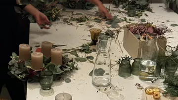 Advent wreath with candles on a table.