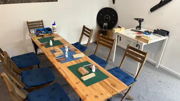 Table with tools in workshop setting.