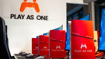 Red folders on desks in gaming room.