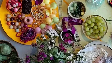 Assorted beads and flowers on table.