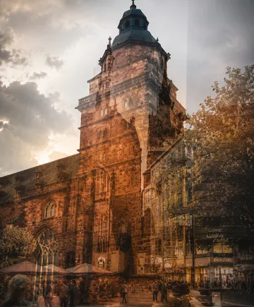 Gothic architecture overlaid on urban scene.