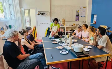 Group cooking class in a bright room.