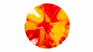 Abstract circular painting with red, yellow swirls.