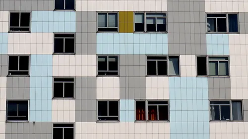Colorful building facade with windows.