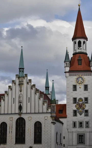 Clock tower beside white historical building.