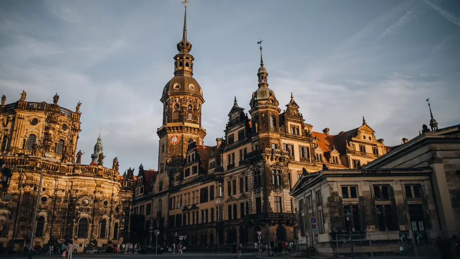 Historic clock tower in European cityscape.