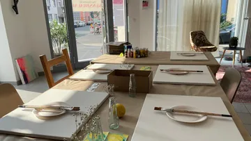 Art studio table with blank canvases.