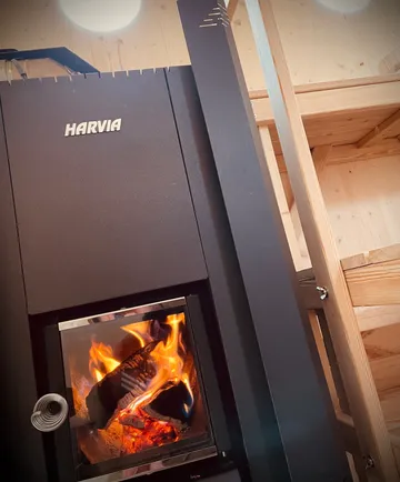 Wood stove burning indoors, cozy atmosphere.