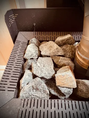 Stones placed inside a sauna heater.